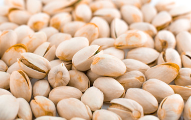 a lot pistachio beans isolated on white