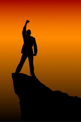 silhouette of a seccess man at the top of the mountain against t