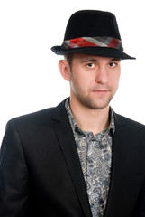 Fototapeta na wymiar Close-up portrait of a handsome man in a hat