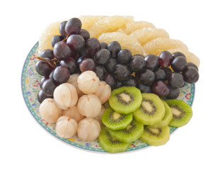 Plate of mixed fruits, isolated on white background