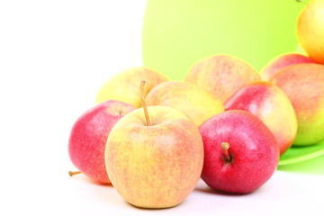 Fresh green, red apples in basket isolated