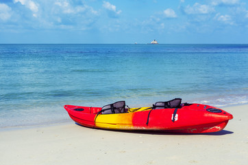 Red kayaks on the beach