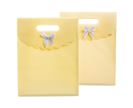 two yellow paper bags isolated