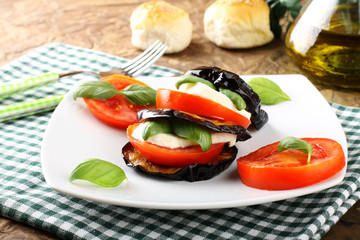Tower of aubergine, mozzarella and tomato