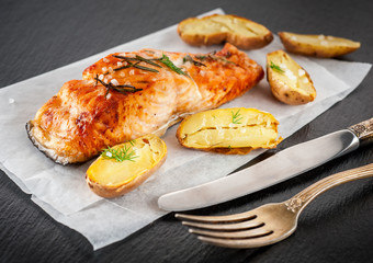 Grilled salmon and baked potatoes