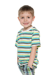 Little boy is standing on the white background