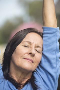 Portrait relaxed mature woman closed eyes