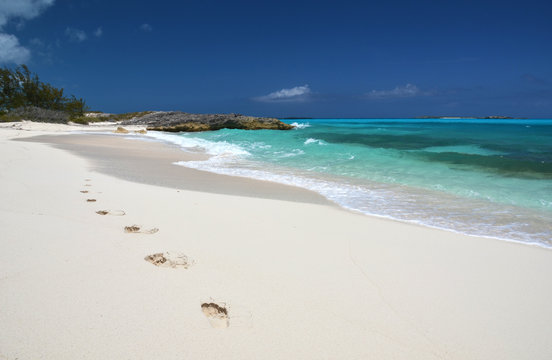 Footprints on the desrt beach of Little Exuma, Bahamas