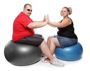 Overweight woman with her personal fitness trainer.