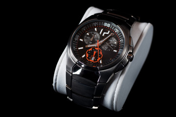 Men's metalic wristwatch, isolated on black background