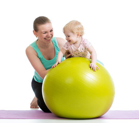 Fototapeta na wymiar mother doing gymnastics with baby on fitness ball