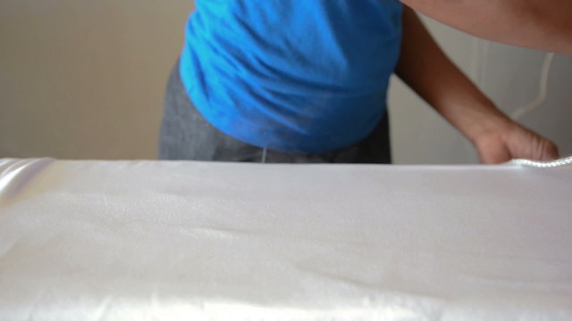 Maid ironing