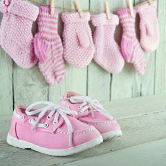 Little girl shoes on green background