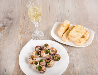 Snails as gourmet food with bread and wine