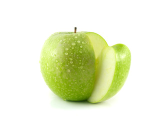 Isolated sliced green apple with water drops.