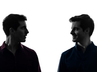 two  men twin brother friends looking at each others silhouette
