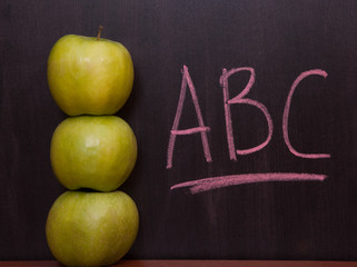 Apples on the chalkboard.