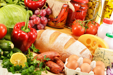 Assorted grocery products including vegetables fruits wine bread