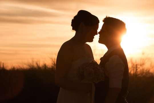 Lesbian Couple At Sunset