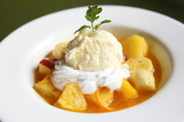 mix fruit flambe banana orange and apple with ice cream