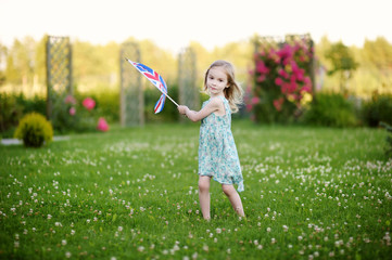 Adorable little girl with United Kingdom flag
