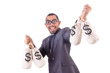 Man with sacks of money on white