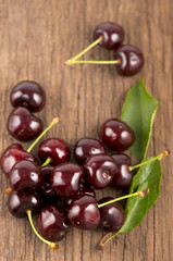 Red, ripe, juicy cherries on wooden boards