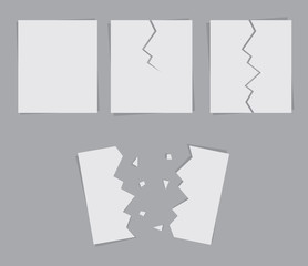 Paper in various states of being ripped in half