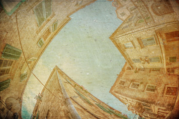 Fish-eye view of the old city on sky background