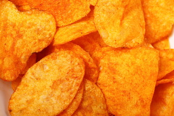 Close up potato paprika chips as background