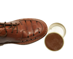 brown leather shoe with shoe polish paste, isolated