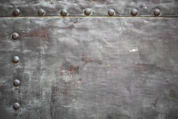 Black metal plate or armour texture with rivets