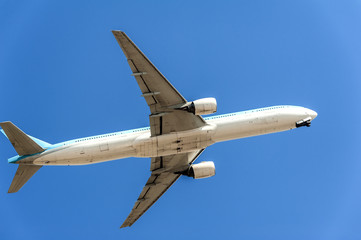 Airplane on the sky background