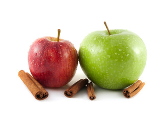 Isolated wet green and red apple with cinnamon