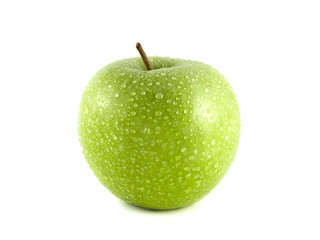 Isolated green apple with water drops on white