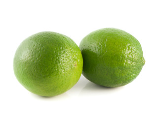 Isolated two green limes on a white background