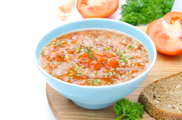 bowl of tomato soup with buckwheat isolated horizontal