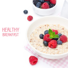 healthy breakfast - oatmeal with fresh berries isolated on white