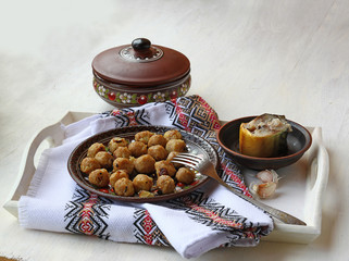 Dumplings and fish on a wooden tray