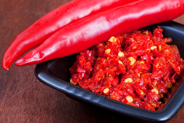 pods of red hot pepper and spicy sause