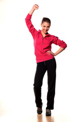 smiling teenage girl in tracksuits with hand up