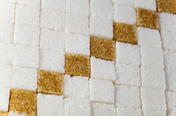 Cubes of not refined reed sugar and white sugar