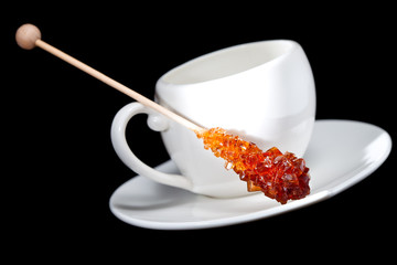 Coffee cup and  candy sugar on a stick
