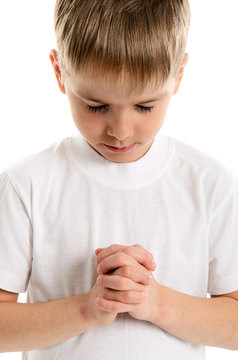 Little boy praying - closeup