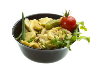 Marinated mushrooms in white saucer isolated on white