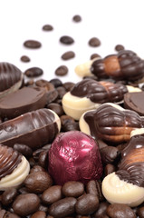 Chocolate candy with coffee beans on a white background .