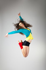 Modern style dancer  posing on grey background