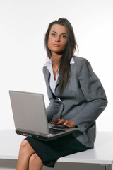 Beautiful young woman working with laptop