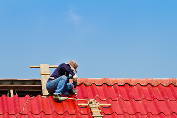 Worker is repairing the roof