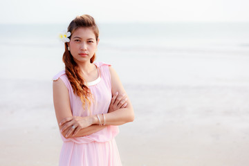 Fototapeta na wymiar Asian woman with plumeria